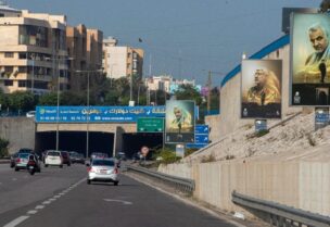 صور قاسم سليماني التي يضعها حزب الله كل فترة على طريق المطار