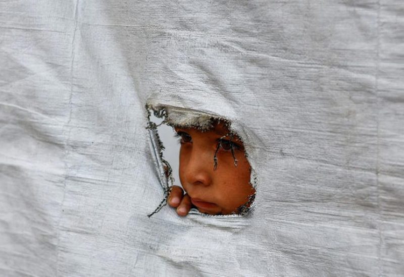 طفل فلسطيني نازح ينظر من خلال ثقب في جدار خيمة في مدينة غزة يوم 6 مايو أيار 2026. تصوير: محمود عيسى - رويترزطفل فلسطيني نازح ينظر من خلال ثقب في جدار خيمة في مدينة غزة يوم 6 مايو أيار 2026. تصوير: محمود عيسى - رويترز