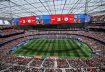 نتيجة مباراة إسبانيا ضد النمسا تظهر على الشاشة مع لاعب المنتخب الإسباني أيمريك لابورت. رويترز
