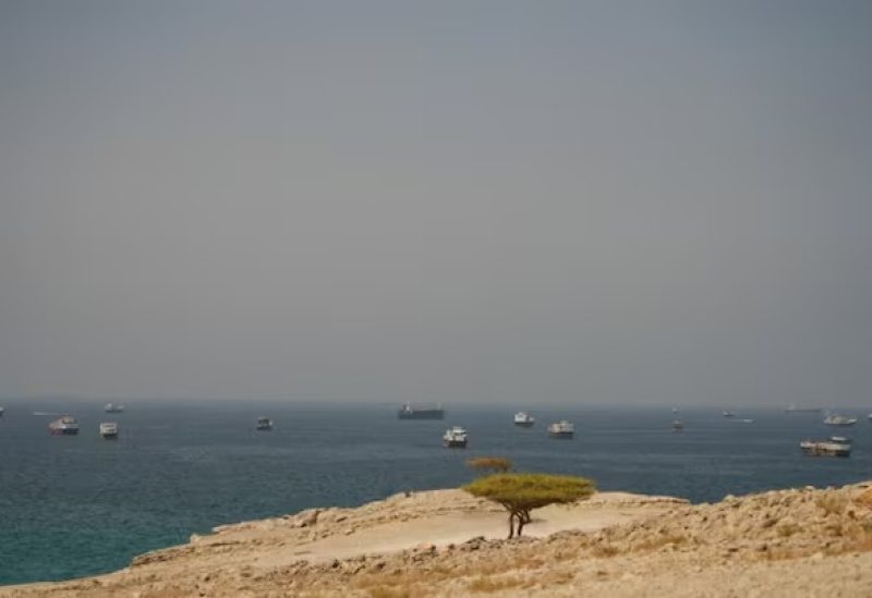 قوارب في مضيق هرمز كما تُرى من مسندم بعمان. رويترز